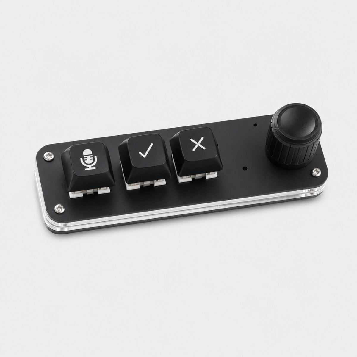 Voice Pad with three labelled keys and one rotary knob on a clear base