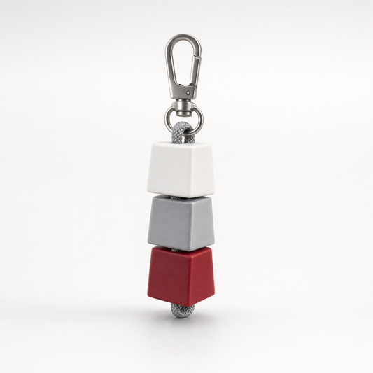 Triple Keycap Charm on a light-gray studio background